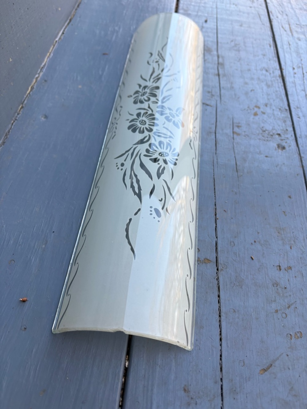 Vintage U-shaped channel glass shade from a Mid-Century Modern bathroom vanity